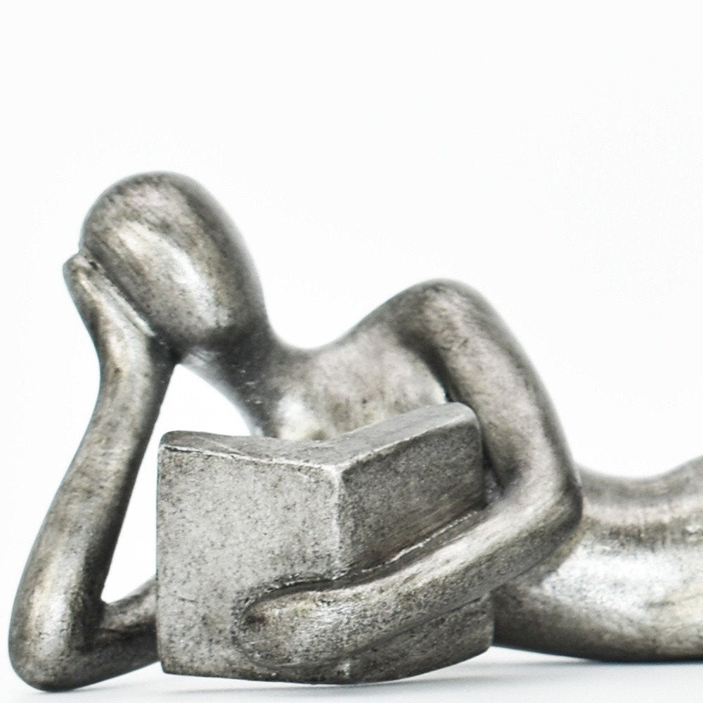 Set of Two Pewter Resin People Tabletop Sculpture on a white background
