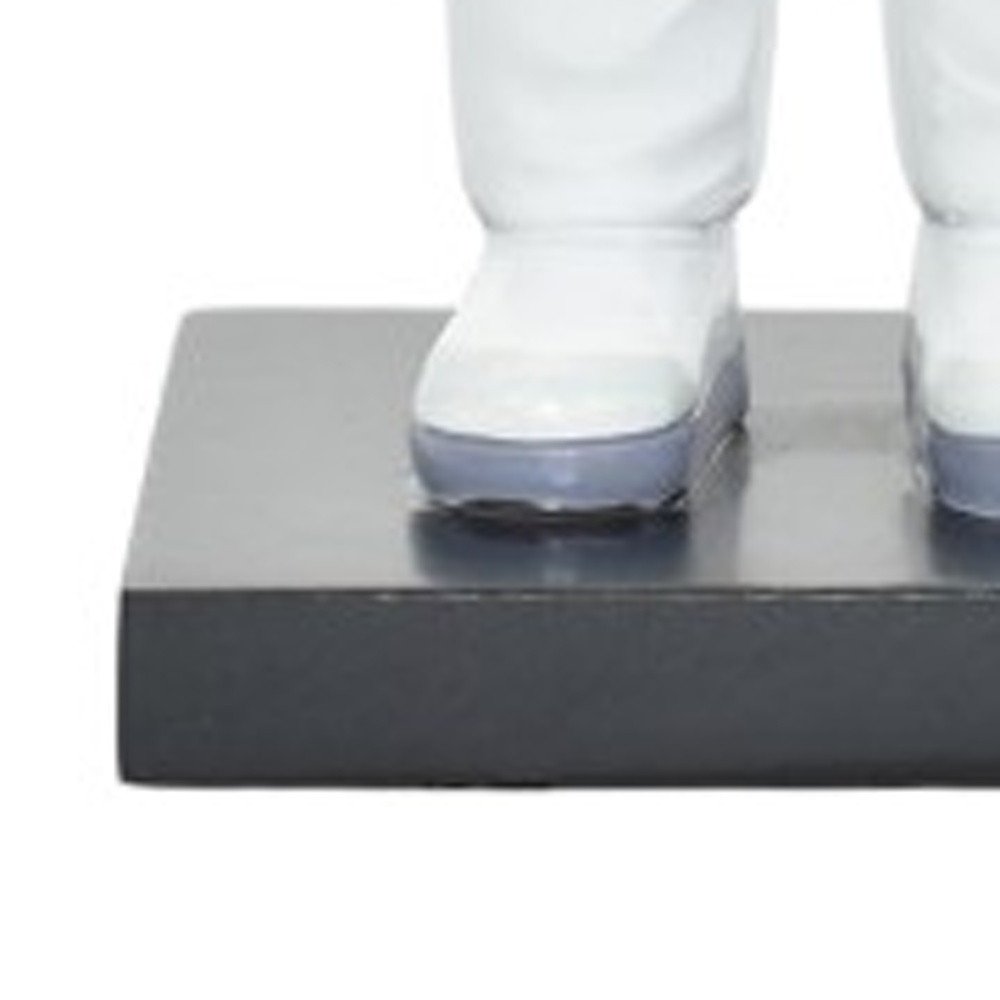 6" White Resin USA Astronaut Tabletop Sculpture. Sculpture isolated on a plain white background, showing a white resin surface.