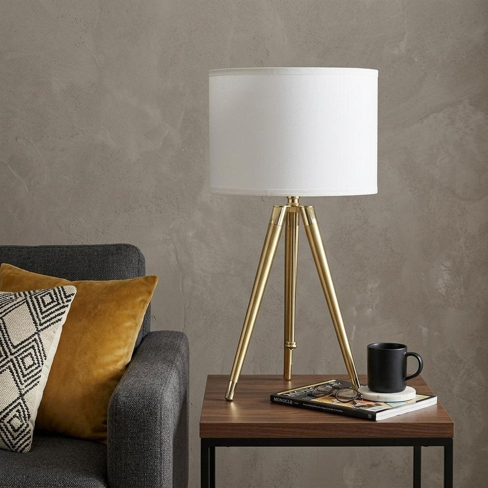 Gold Metal Adjustable Height Tripod Table Lamp With White Drum Shade