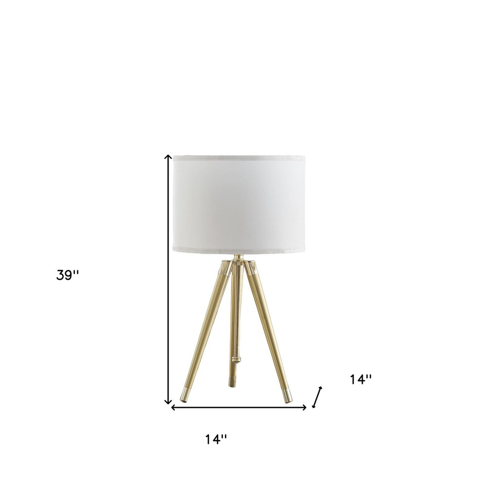 Gold Metal Adjustable Height Tripod Table Lamp With White Drum Shade on a white background