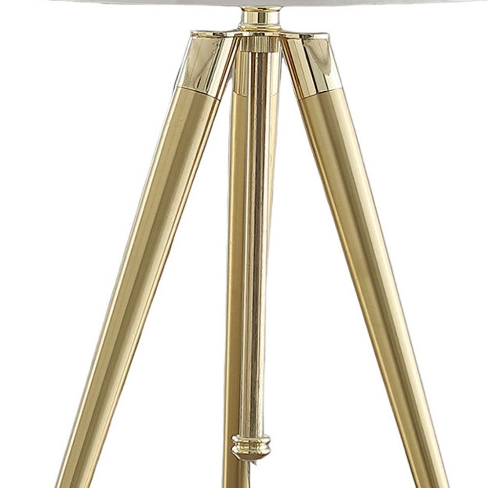 Gold Metal Adjustable Height Tripod Table Lamp With White Drum Shade on a white background
