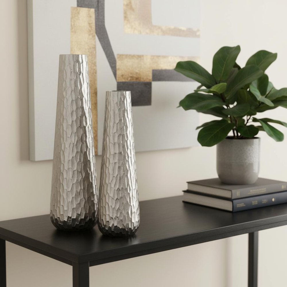 Set of Two Silver Cast Aluminum Textured Table Vases in a home interior