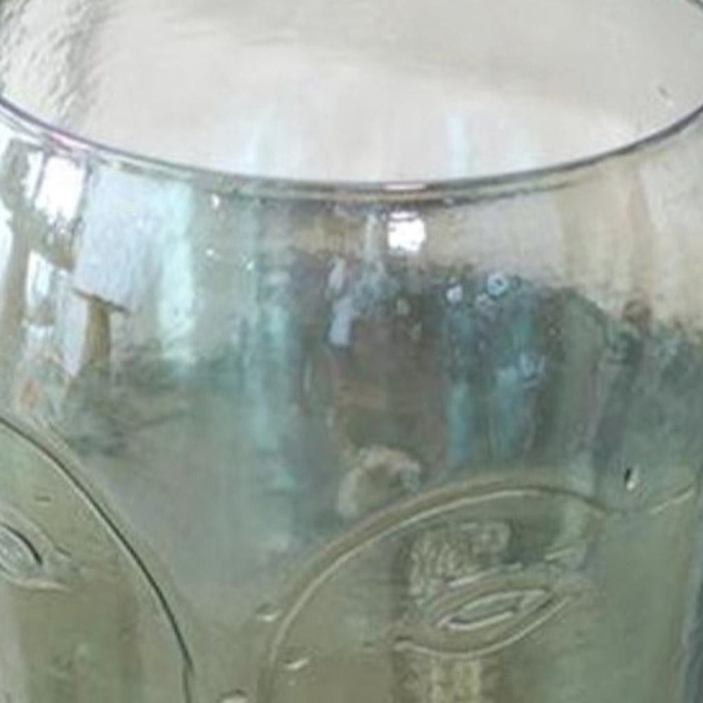 Set of Two Light Green Glass Modern Abstract Faces Table Vases in a home interior