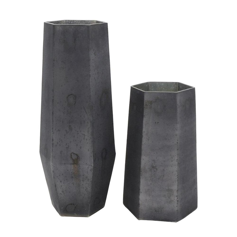 Two black hexagonal glass vases of different heights on a white background.