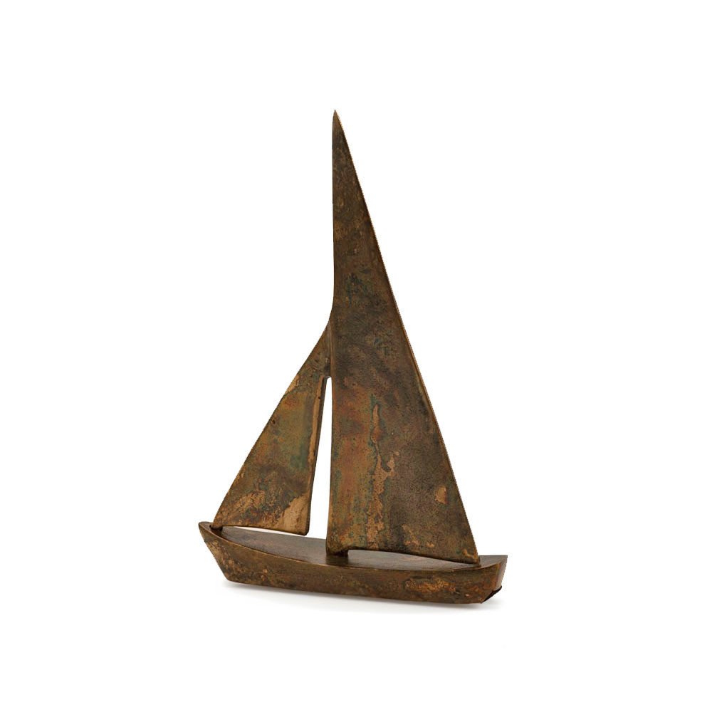 12" Rust Aluminum Decorative Sailboat Tabletop Sculpture. Sculpture isolated on a plain white background, showing a dark brown metal surface.