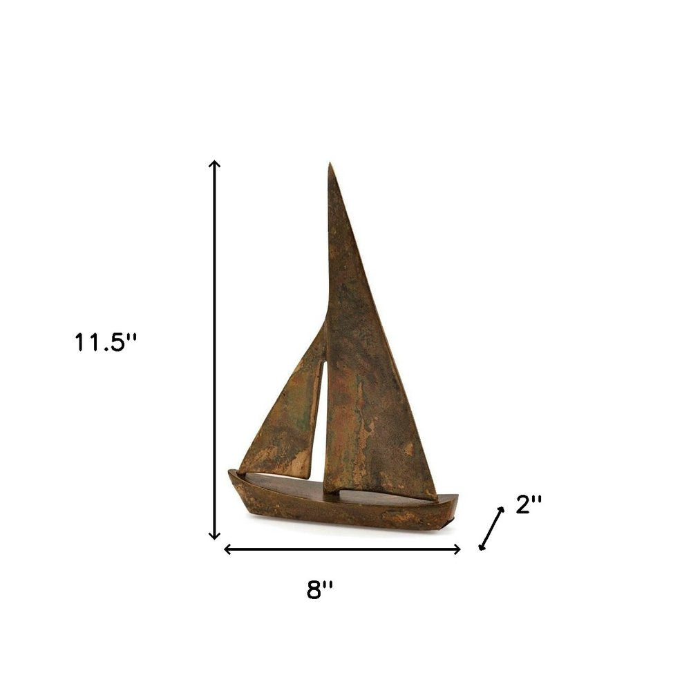 12" Rust Aluminum Decorative Sailboat Tabletop Sculpture. Sculpture isolated on a plain white background, showing a dark brown metal surface.