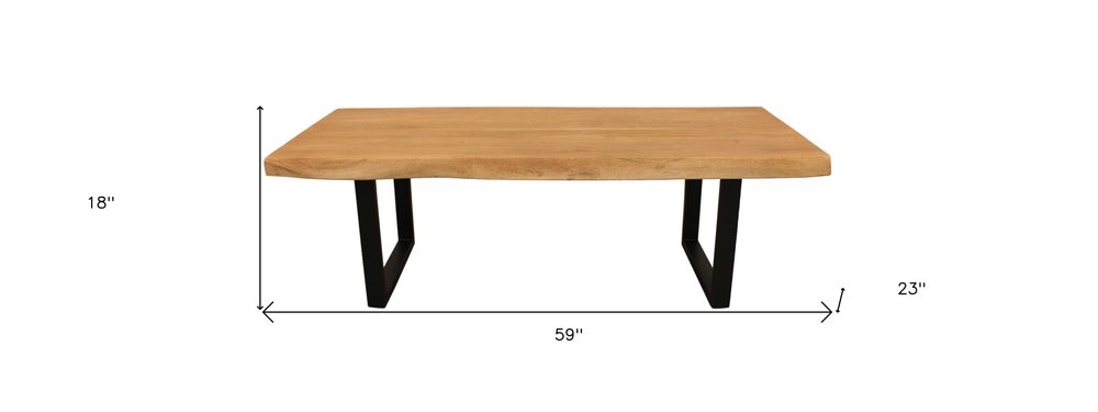 59" Natural And Black Solid Wood And Iron Live Edge Coffee Table. Coffee table isolated on a plain white background, finished in black wood.