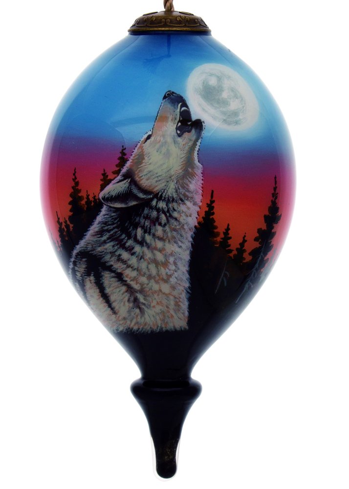 Hand-painted glass finial ornament featuring a wolf howling at the moon against a sunset and forest background.