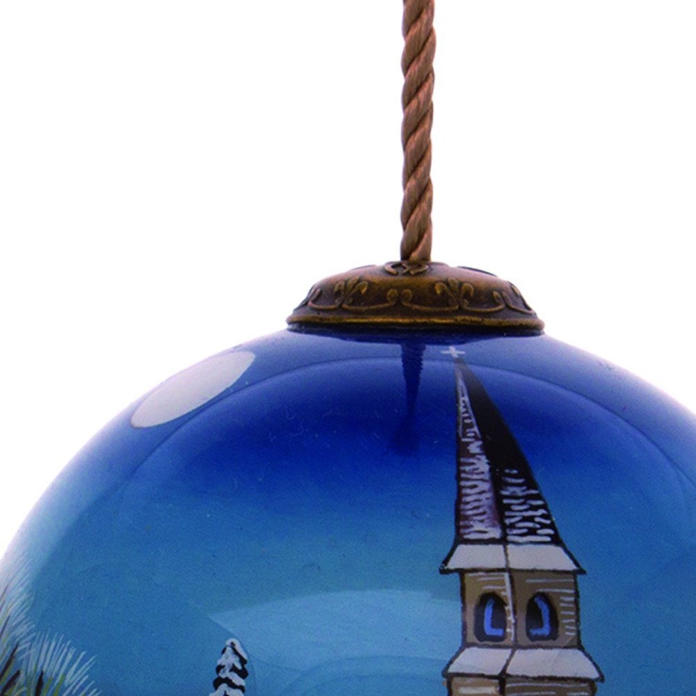 Snowy Church Christmas Hand Painted Blue And White Glass Ball Ornament on a white background