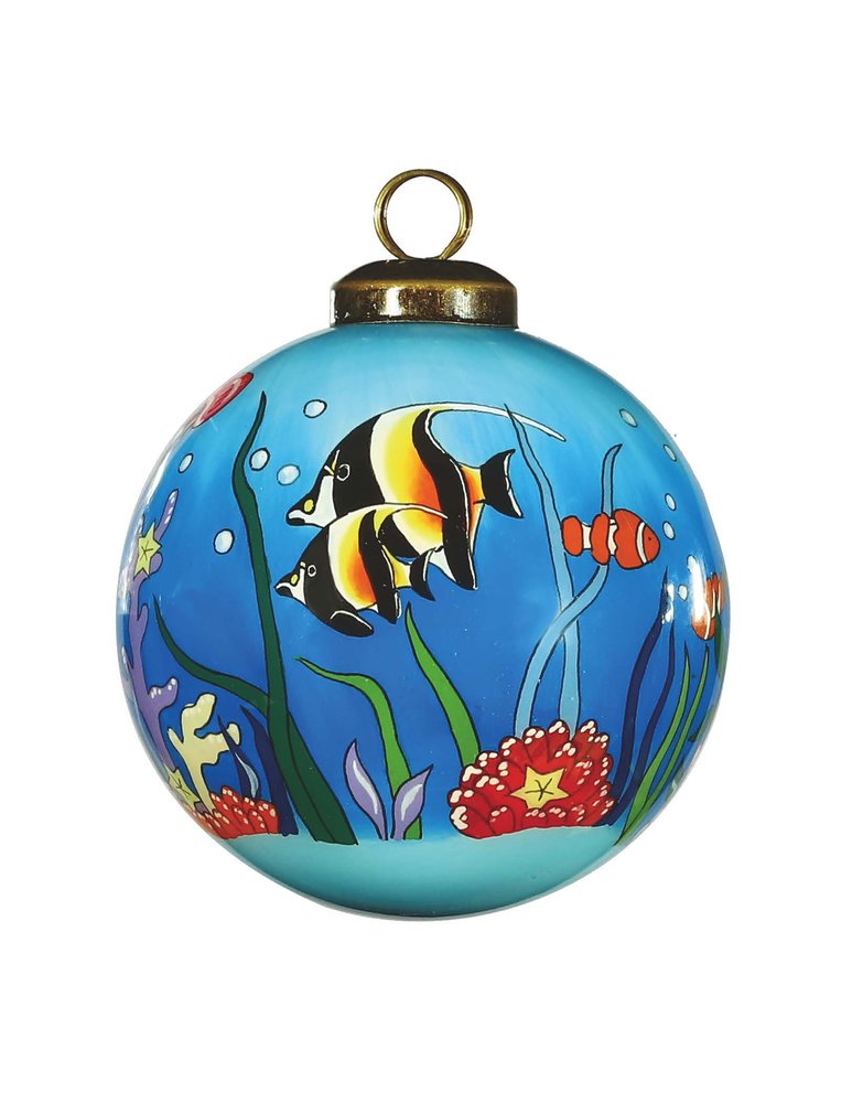 Blue glass ball ornament with a tropical fish and coral reef scene, featuring hand-painted details in green, blue, and red.