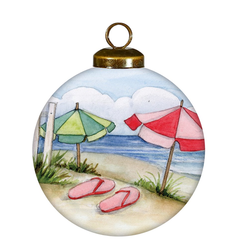 Hand-painted glass ball ornament depicting a beach scene with red and green umbrellas, pink flip-flops, and the ocean.