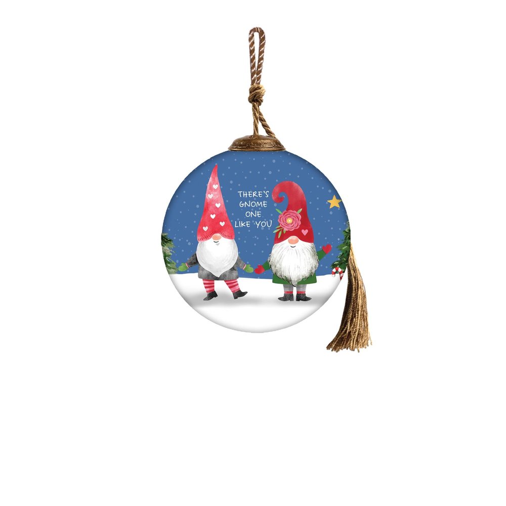 Round glass Christmas ornament with two gnomes, a snowy forest scene, and text that reads "There's gnome one like you.