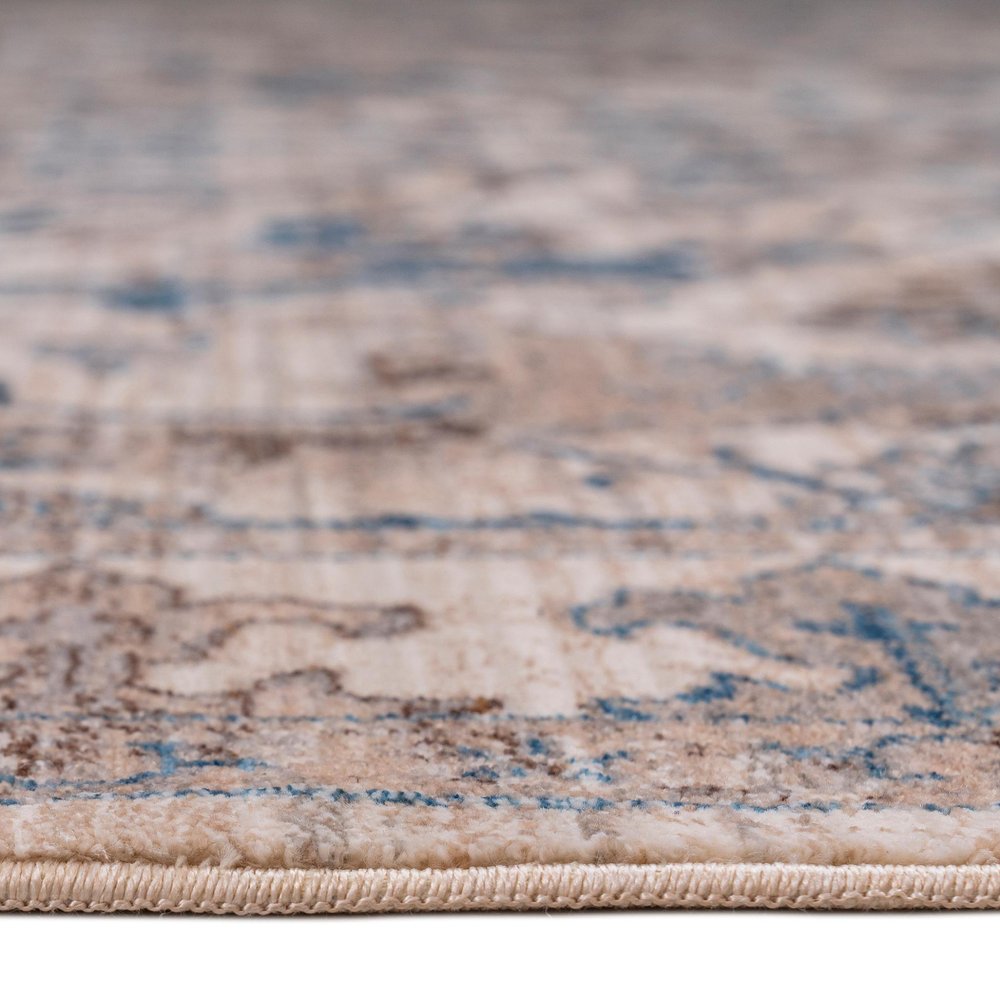 9' X 13' Tan And Blue Oriental Area Rug With Fringe close-up detail