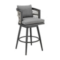 Gray metal swivel outdoor counter height bar chair with woven back and gray cushions on white background.