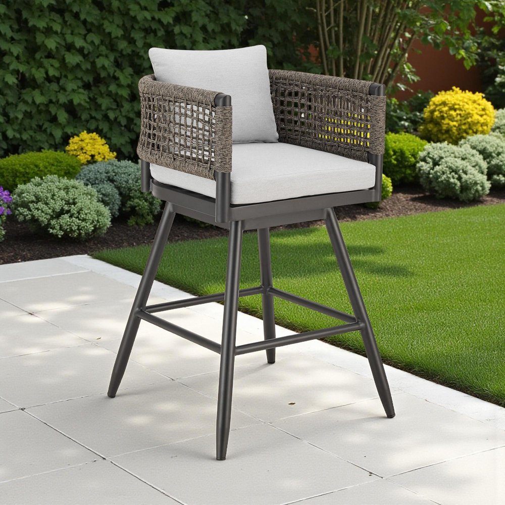 35" Light Gray Metal Swivel Low back Outdoor Counter Height Bar chair with Footrest shown outdoors on a tiled patio with greenery.