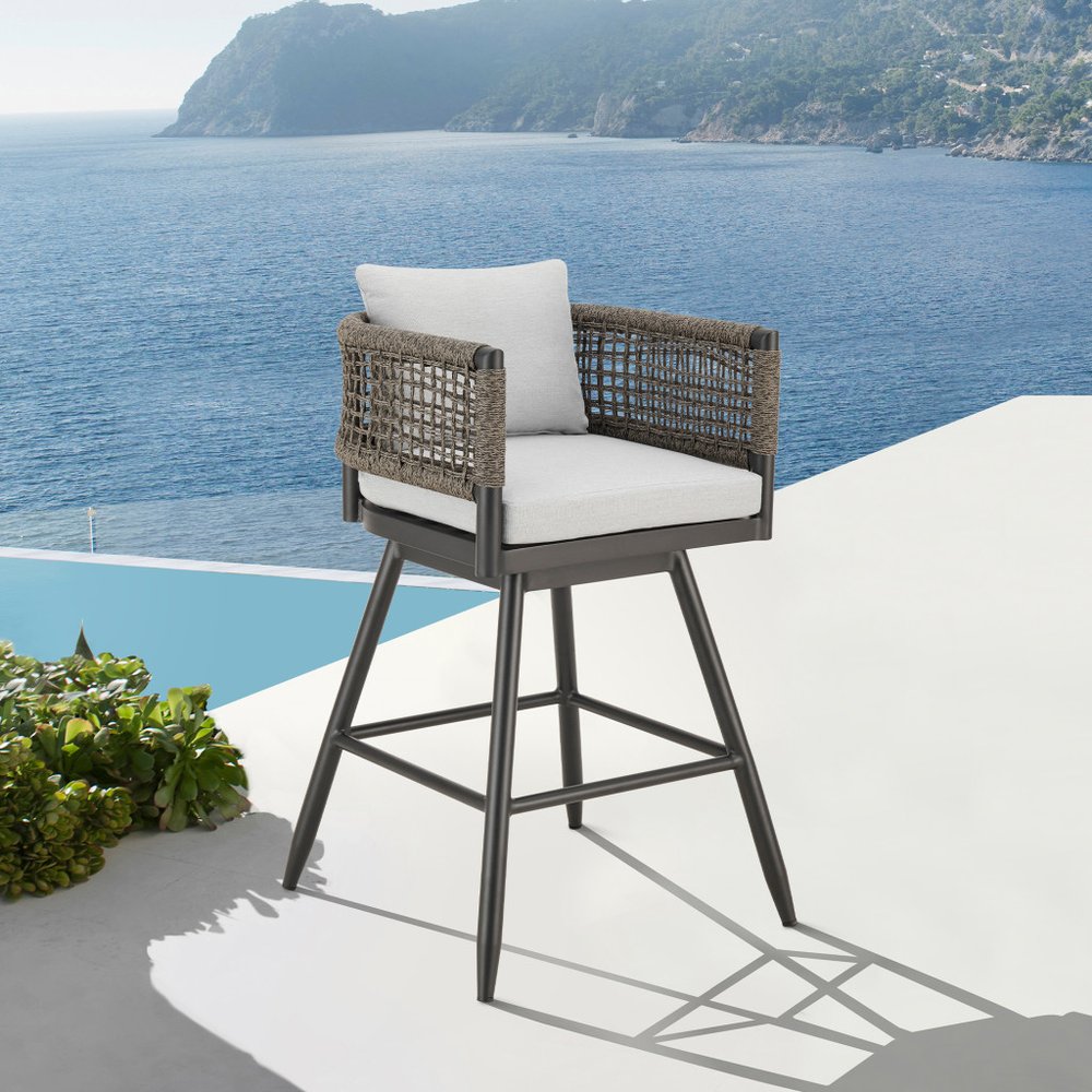 35" Light Gray Metal Swivel Low back Outdoor Counter Height Bar chair with Footrest shown outdoors on a patio.