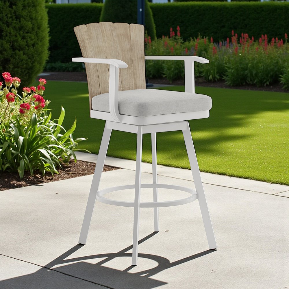 40" Gray Metal Swivel Outdoor Counter Height Bar chair with Footrest shown outdoors on a patio with greenery.