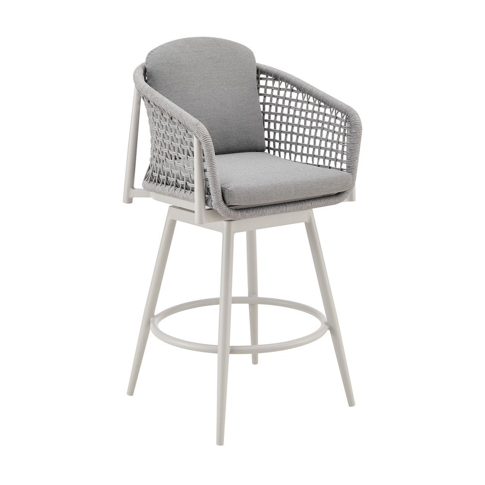 Light gray metal swivel outdoor bar chair with woven gray seat and back cushions and a footrest on a white background.