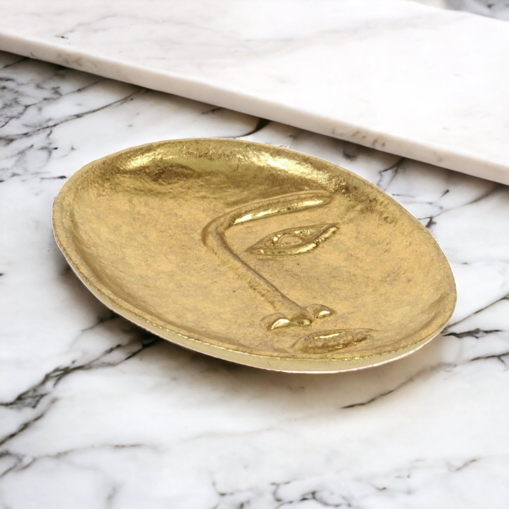 8" Gold Cast Iron Mod Abstract Face Oval Trinket Tray on a white background