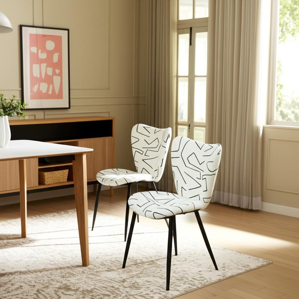 Set of Two White and Black Upholstered Faux Shearling Dining Side Chairs in a home interior