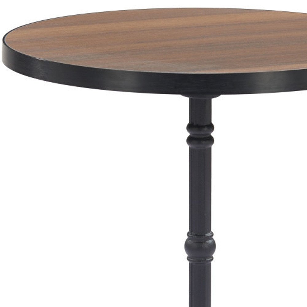 Round walnut wood tabletop with black metal edge and pedestal base on a white background.