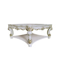 Ivory and gold ornate square coffee table with a lower shelf, made of wood, on a white background.