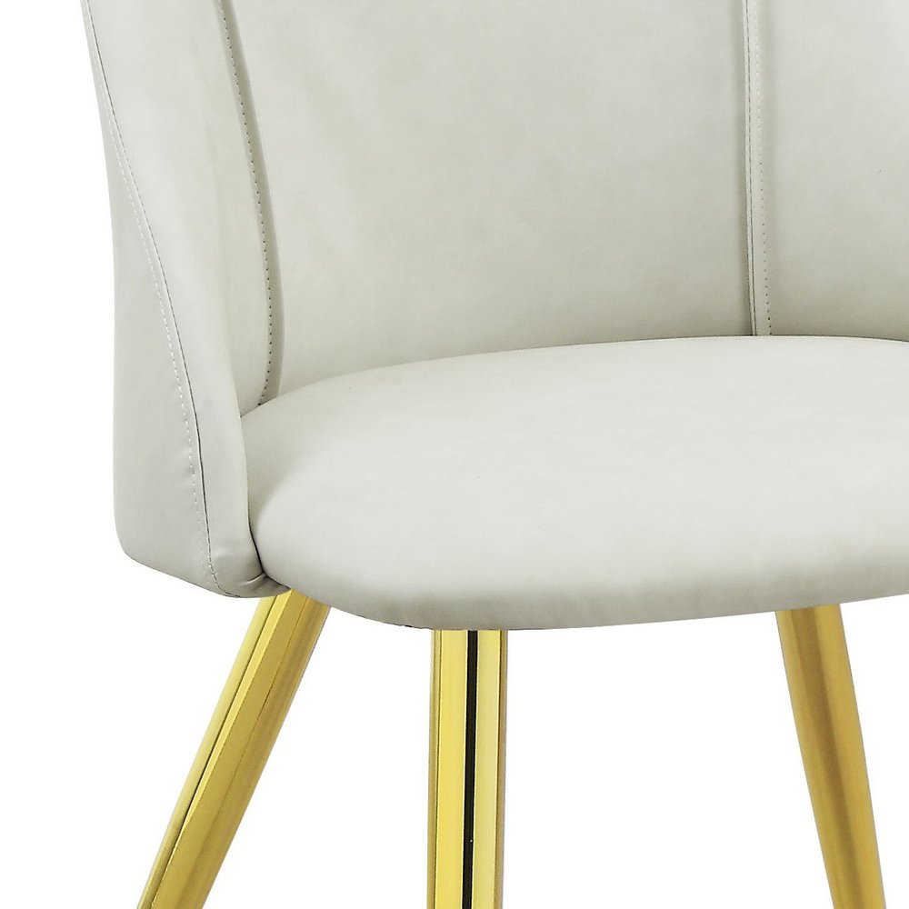 Set of Two White and Gold Upholstered Faux Leather And Metal Dining Side Chairs on a white background