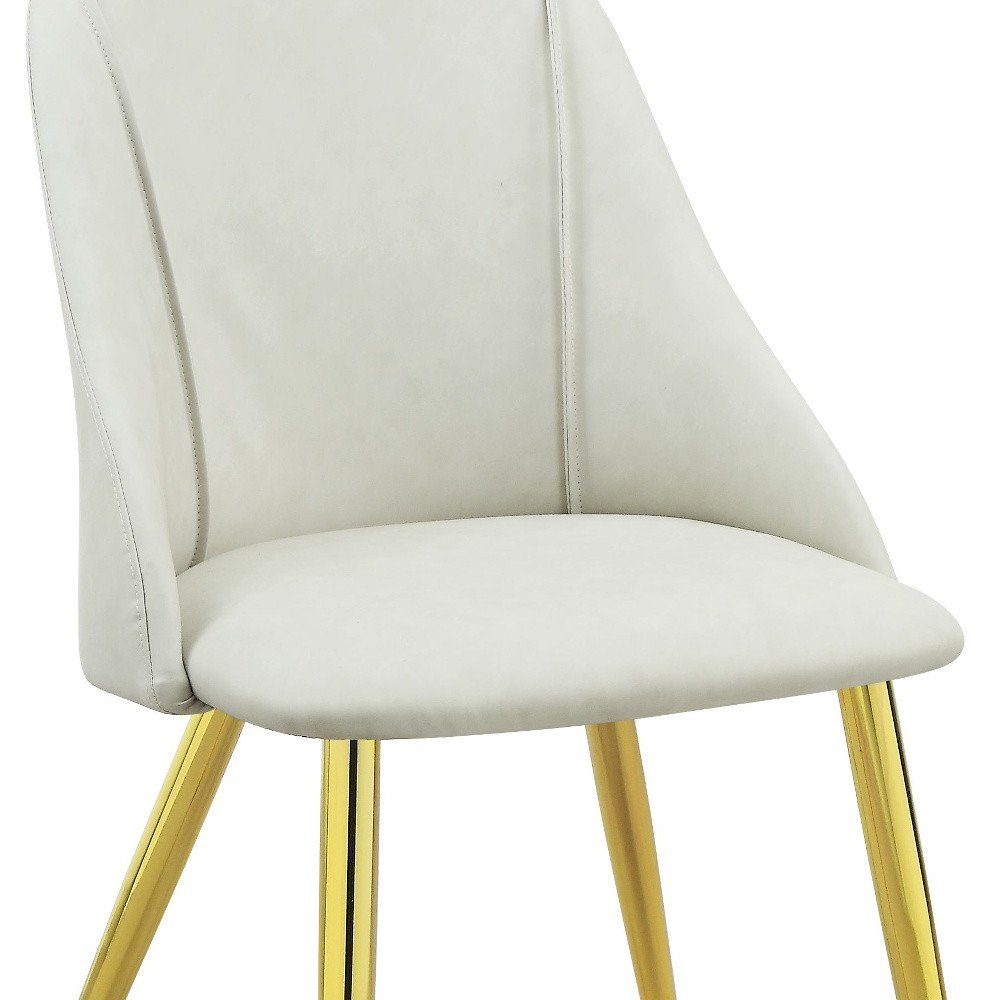 Set of Two White and Gold Upholstered Faux Leather And Metal Dining Side Chairs on a white background