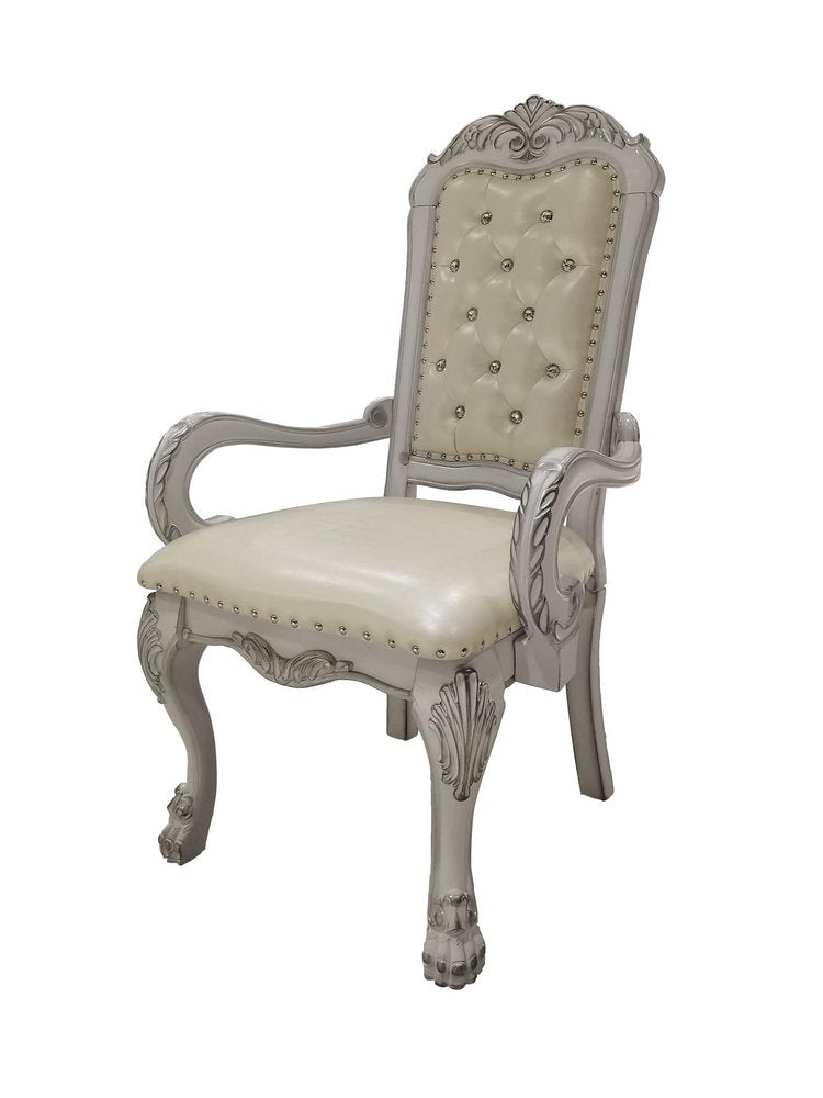 Set of Two Tufted White Upholstered Faux Leather And Wood Dining Arm Chairs on a white background