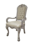 Set of Two Tufted White Upholstered Faux Leather And Wood Dining Arm Chairs on a white background
