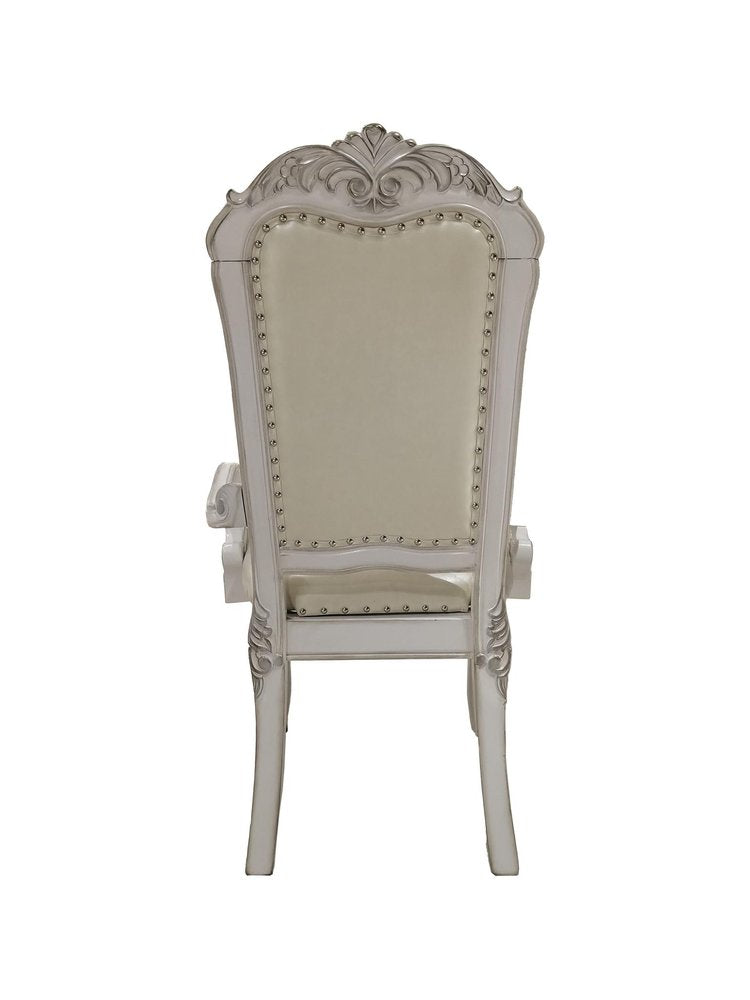 Set of Two Tufted White Upholstered Faux Leather And Wood Dining Arm Chairs on a white background