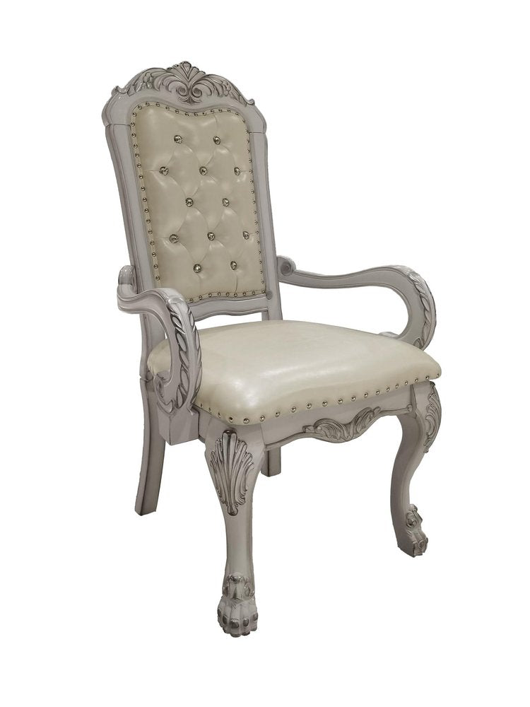 Set of Two Tufted White Upholstered Faux Leather And Wood Dining Arm Chairs on a white background