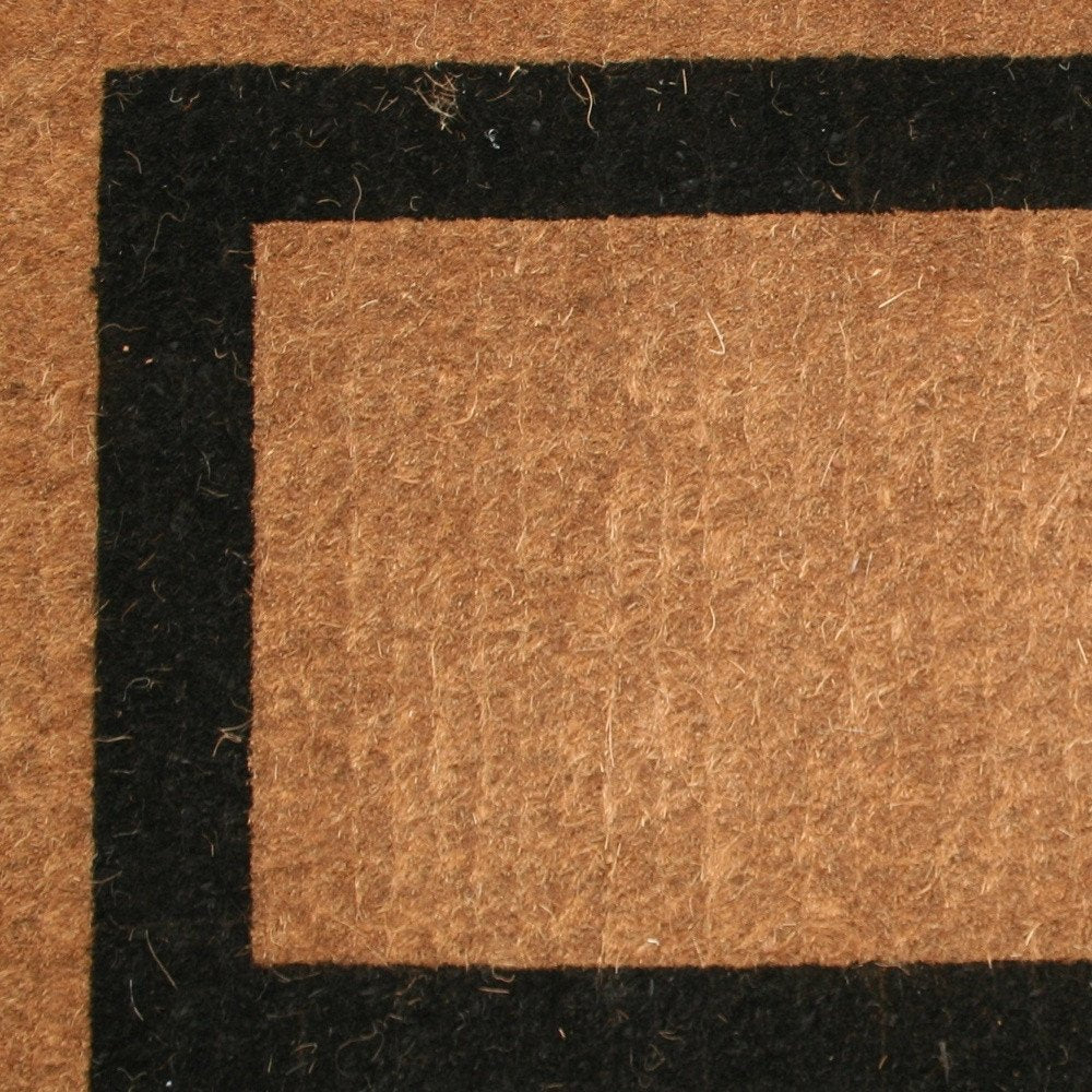 36" X 60" Brown and Black Coir Outdoor Door Mat photographed against a dark studio background in black.
