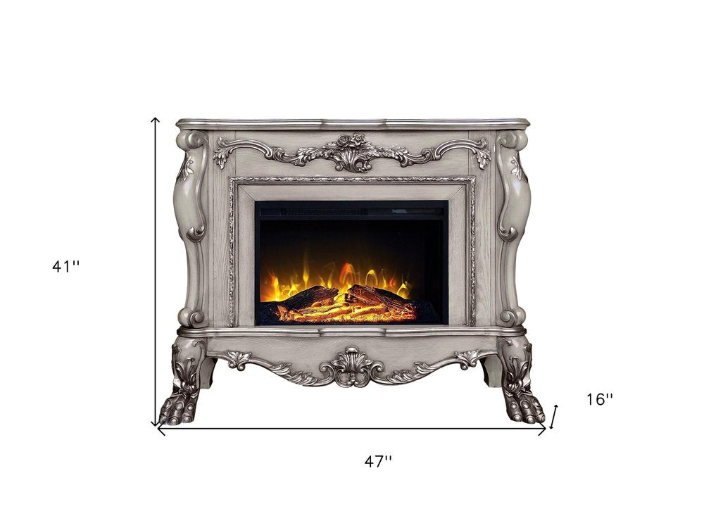47" Bone Wood Ornate Carved Scrollwork Electric Free Standing Fireplace With Mantle. Fireplace isolated on a plain white background, finished in gray wood.
