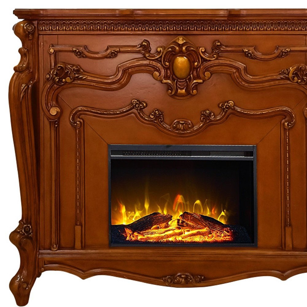 Close-up of 59" Brown Wood Ornate Carved Scrollwork Electric Fireplace With Mantle showing brown wood detail.