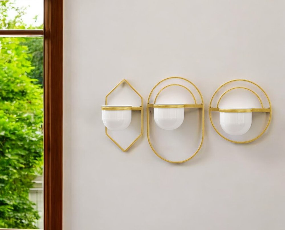 Set of Three Gold And White Metal 10 Ounce Wall Planters in a home interior