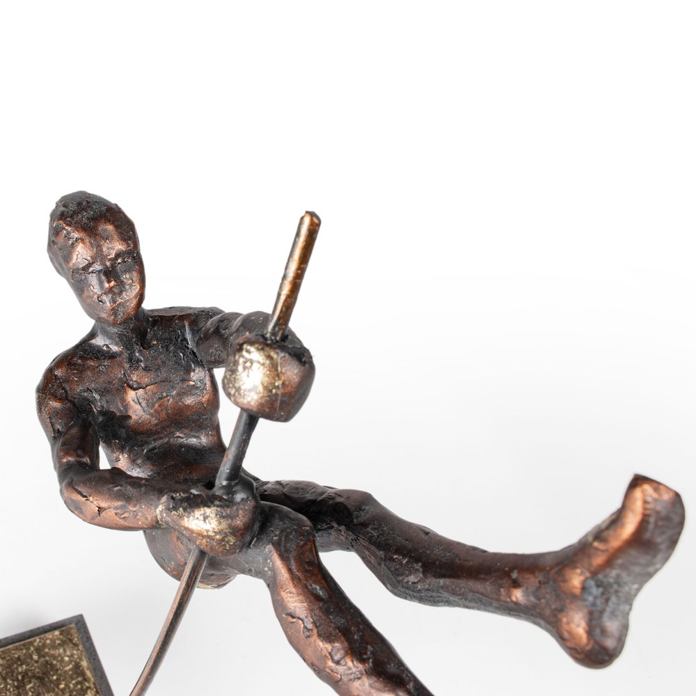 15" Bronze Resin Pole Vaulting Man Tabletop Sculpture. Sculpture isolated on a plain white background, finished in bronze resin.