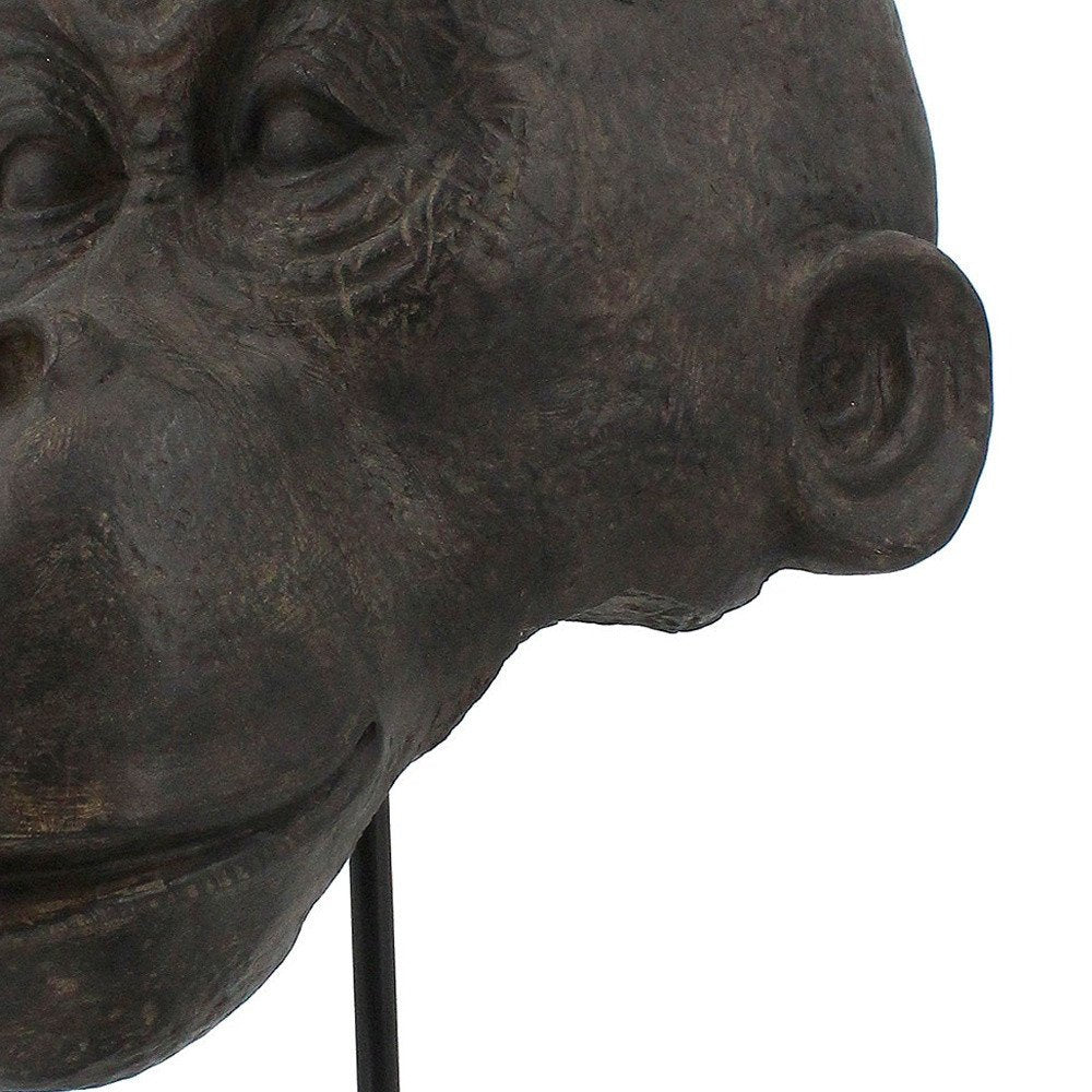16" Brown Resin Gorilla Face Tabletop Sculpture. Sculpture in brown resin.