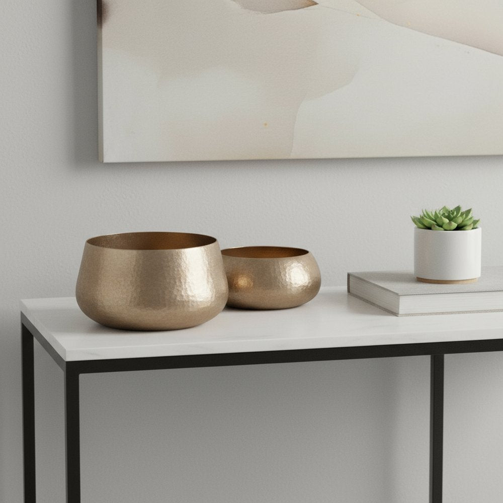 Set of Two Gold Aluminum Round Table Vases in a home interior