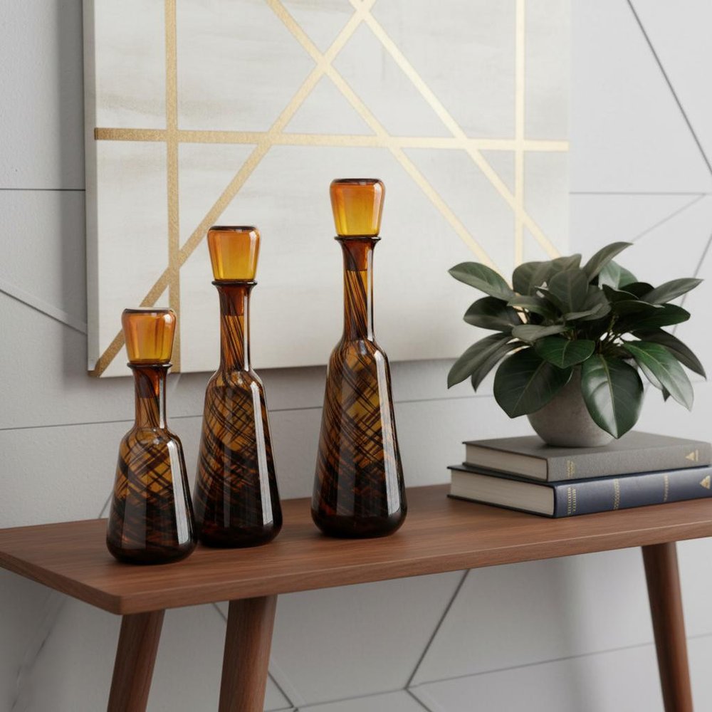 Set of Three Amber Abstract Swirl Glass Decorative Bottles With Stoppers in a home interior