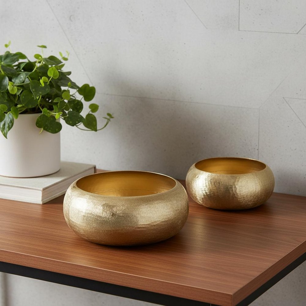 Set of Two Gold Aluminum Hammered Round Centerpiece Bowls in a home interior