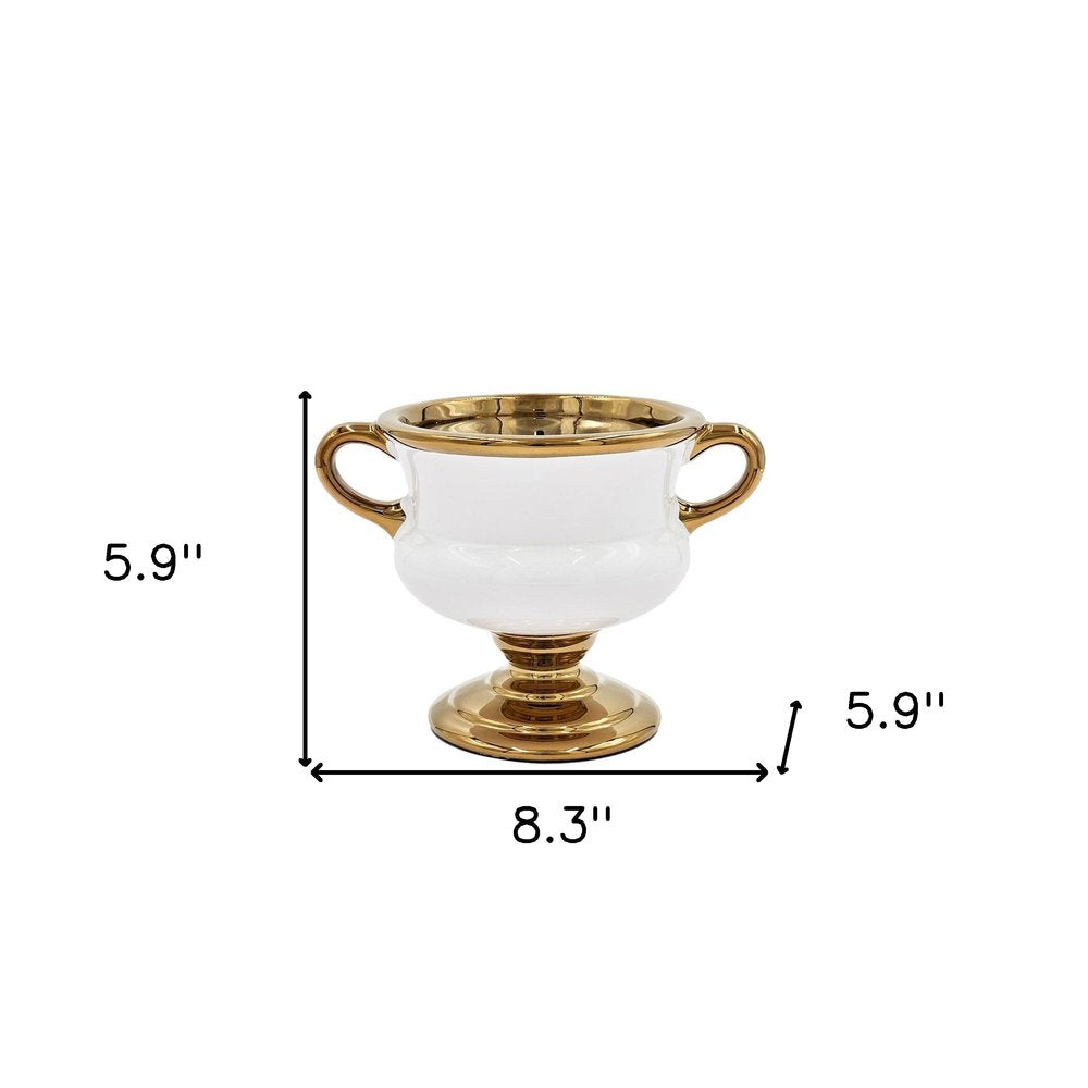 6" White And Gold Amphora Ceramic Table Vase. Vase isolated on a plain white background, finished in gold ceramic.