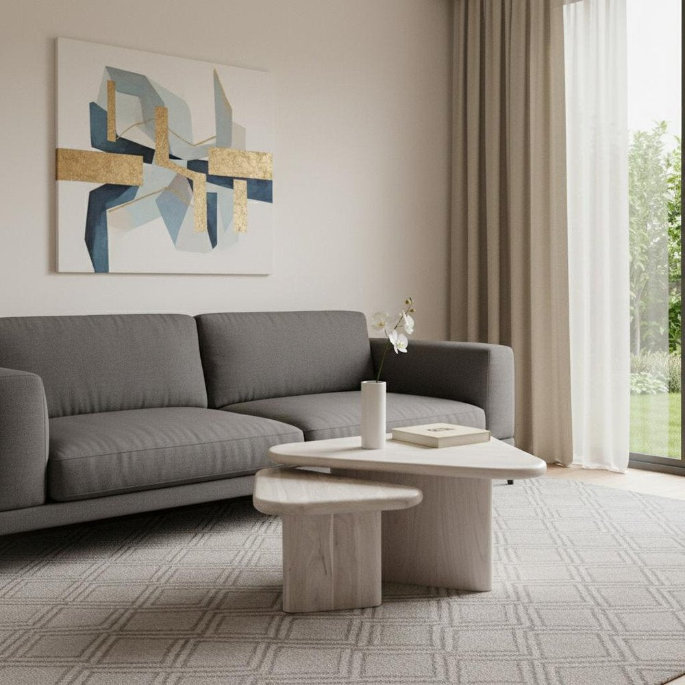 Set of Two Natural Solid Wood Triangle Pedestal Nested Coffee Tables in a home interior