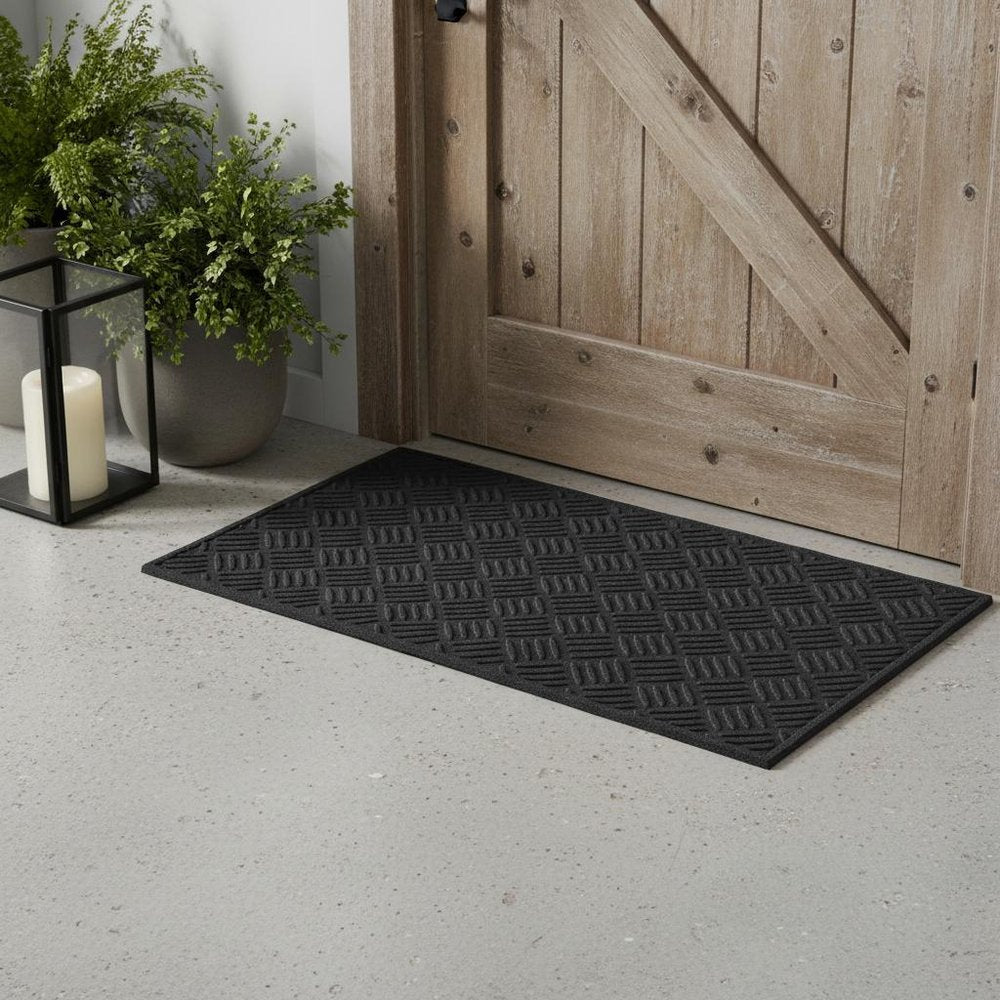 9" X 30" Black Rubber Outdoor Door Mat in a home interior