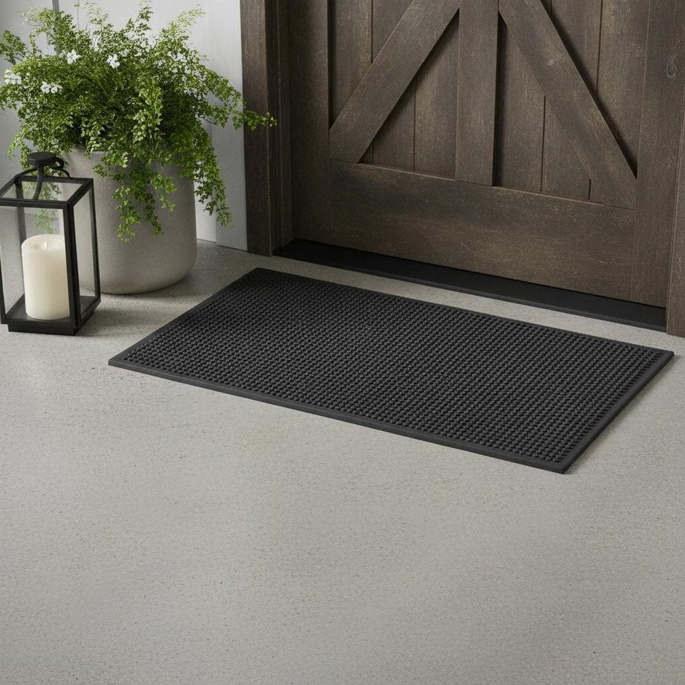 9" X 30" Black Rubber Outdoor Door Mat in a home interior