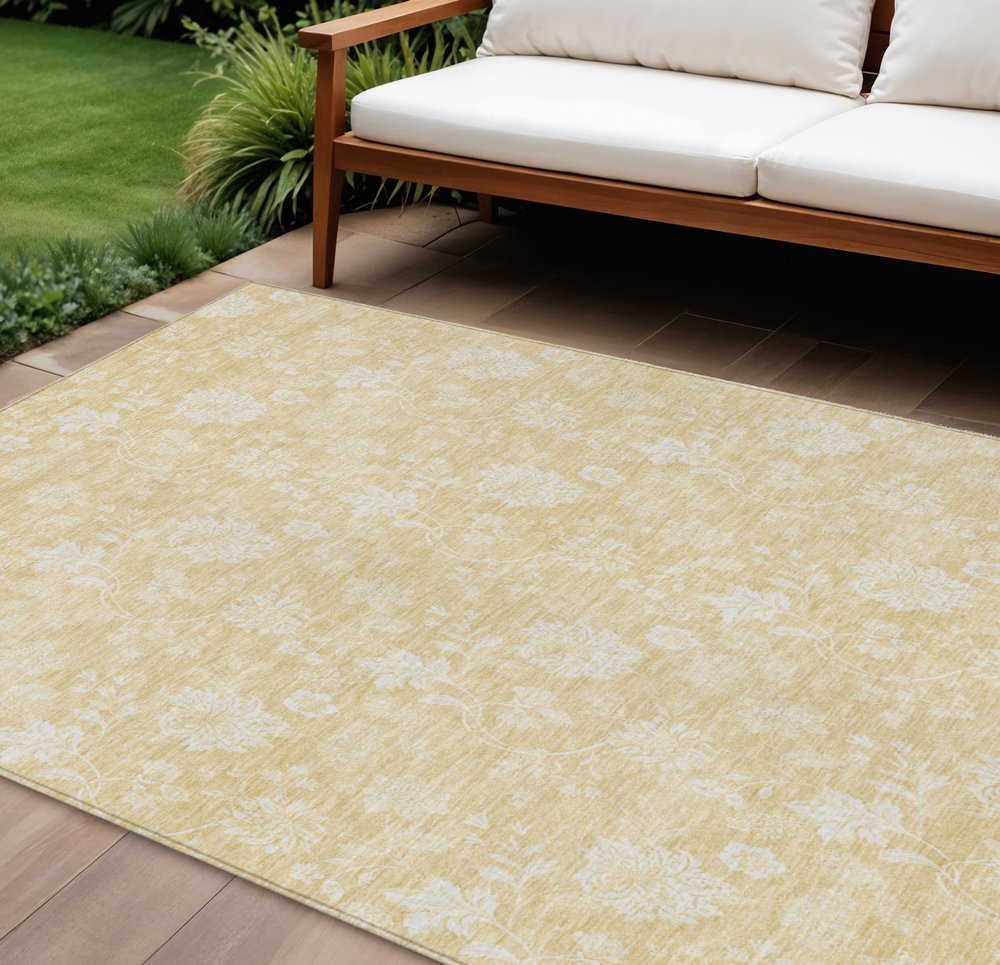 9' X 12' Yellow Wheat And Ivory Floral Washable Indoor Outdoor Area Rug in a home interior