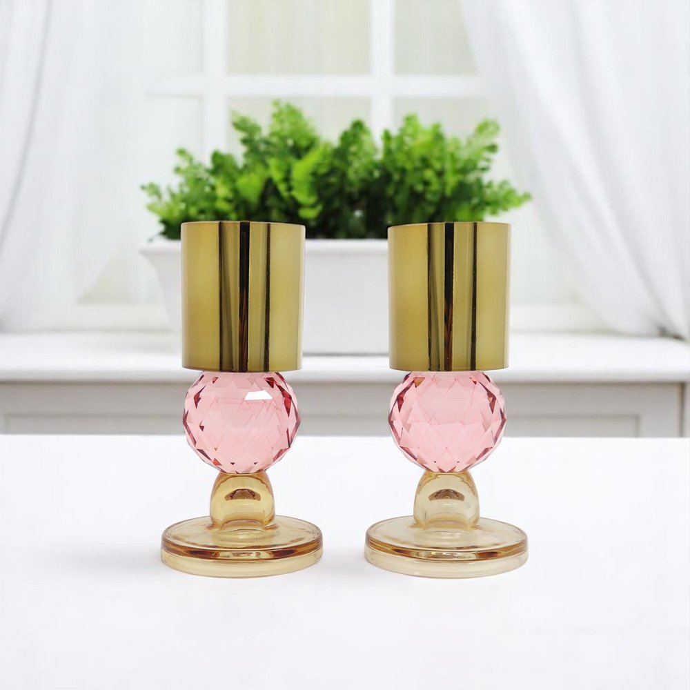 Set of Two Amber Gold And Pink Faceted Crystal Tabletop Taper Candlesticks on a white background