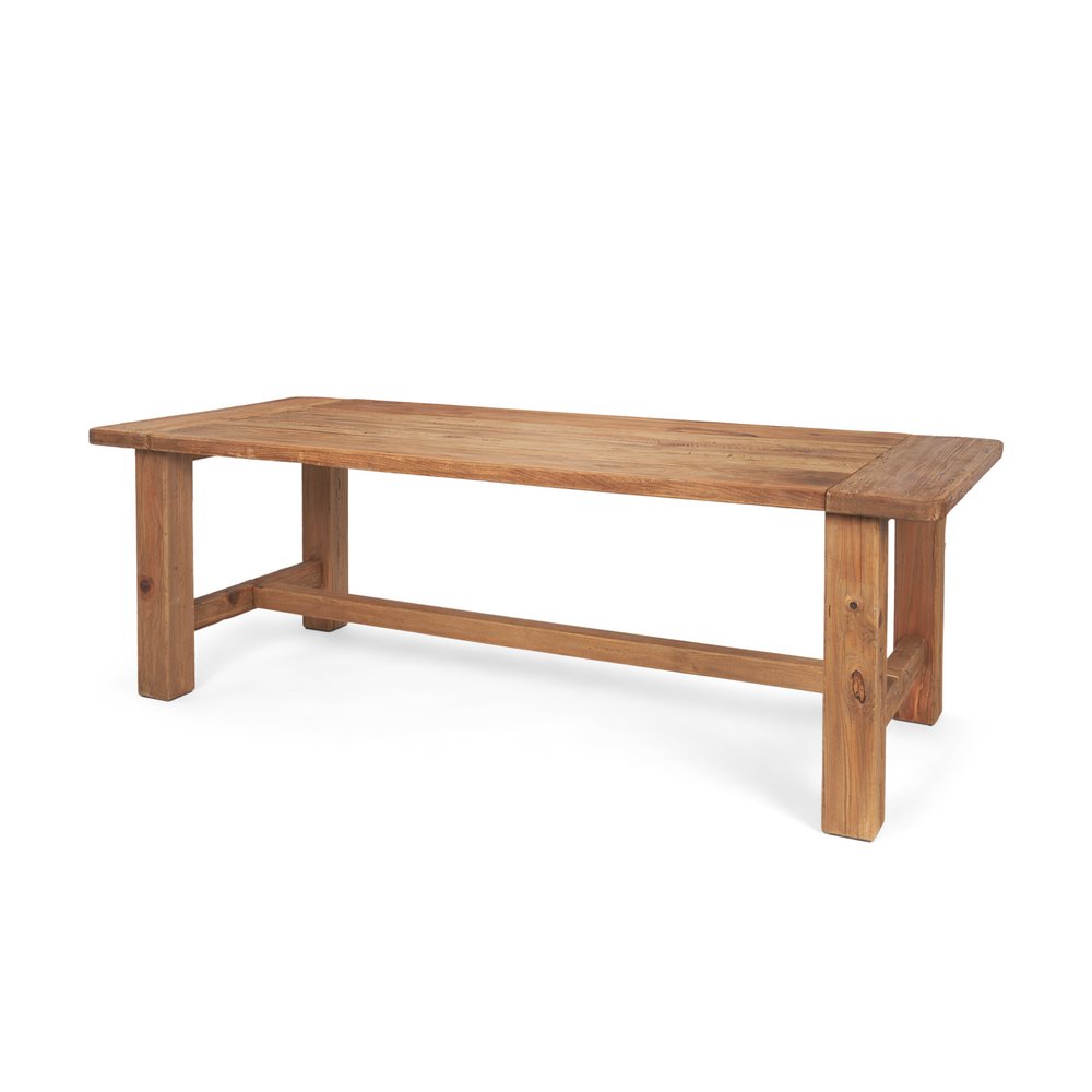 Natural reclaimed wood dining table with trestle base on a white background.