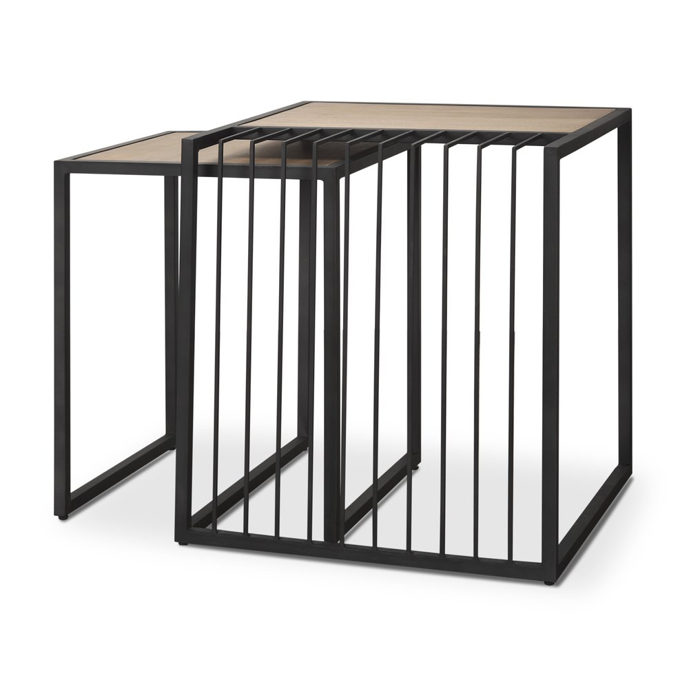 Set of two natural wood and black metal square sled nested tables on a white background.