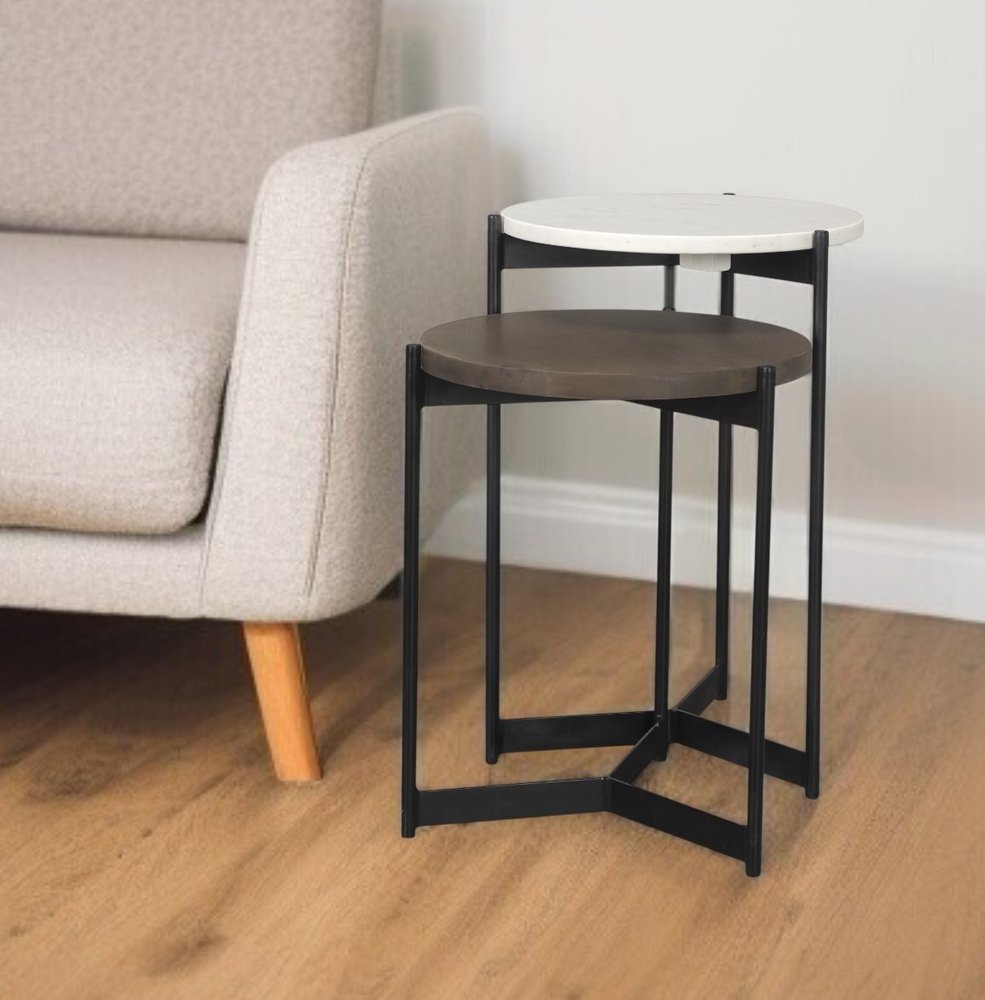 Set of Two Dark Brown and Black Marble Solid Wood and Metal Round Nested Tables in a home interior